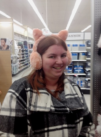 Krystal trying on hats